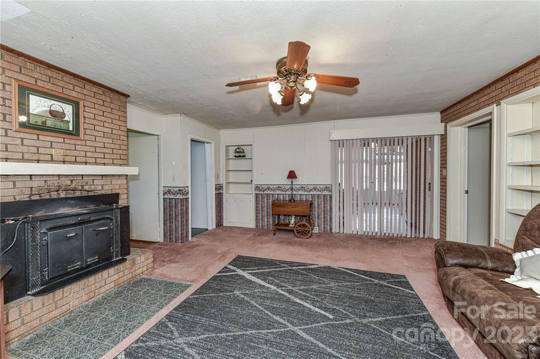 6308 Indian Trail Fairview Road Hemby Bridge, NC 28079 - Photo 21 of 36 a view of a livingroom with furniture and a fireplace