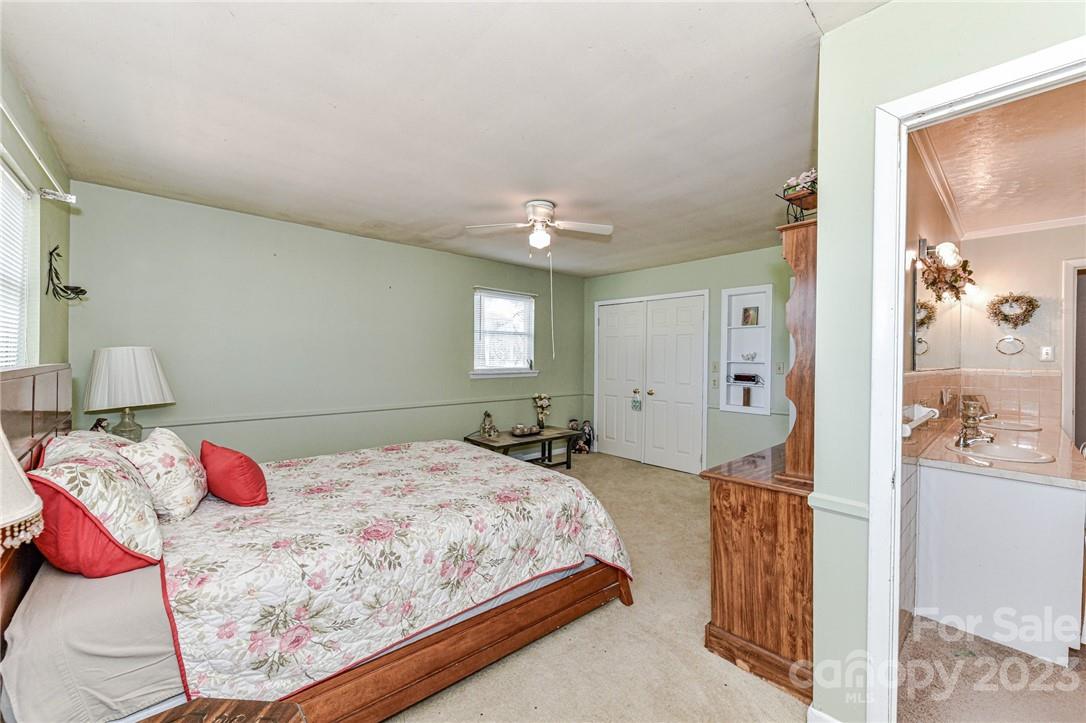 6308 Indian Trail Fairview Road Hemby Bridge, NC 28079 - Photo 26 of 36 a bedroom with a bed and window