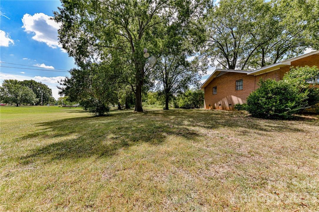 6308 Indian Trail Fairview Road Hemby Bridge, NC 28079 - Photo 3 of 36 a view of a house with a yard