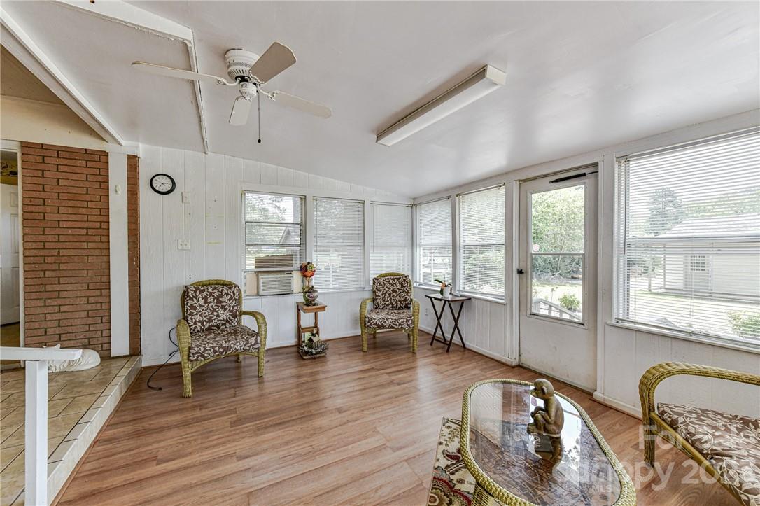 6308 Indian Trail Fairview Road Hemby Bridge, NC 28079 - Photo 35 of 36 a living room with furniture and wooden floor