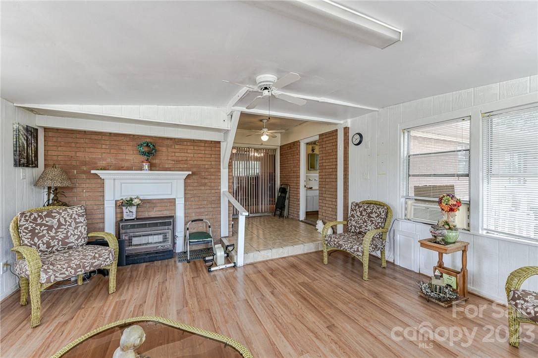 6308 Indian Trail Fairview Road Hemby Bridge, NC 28079 - Photo 36 of 36 a living room with furniture and a wooden floor