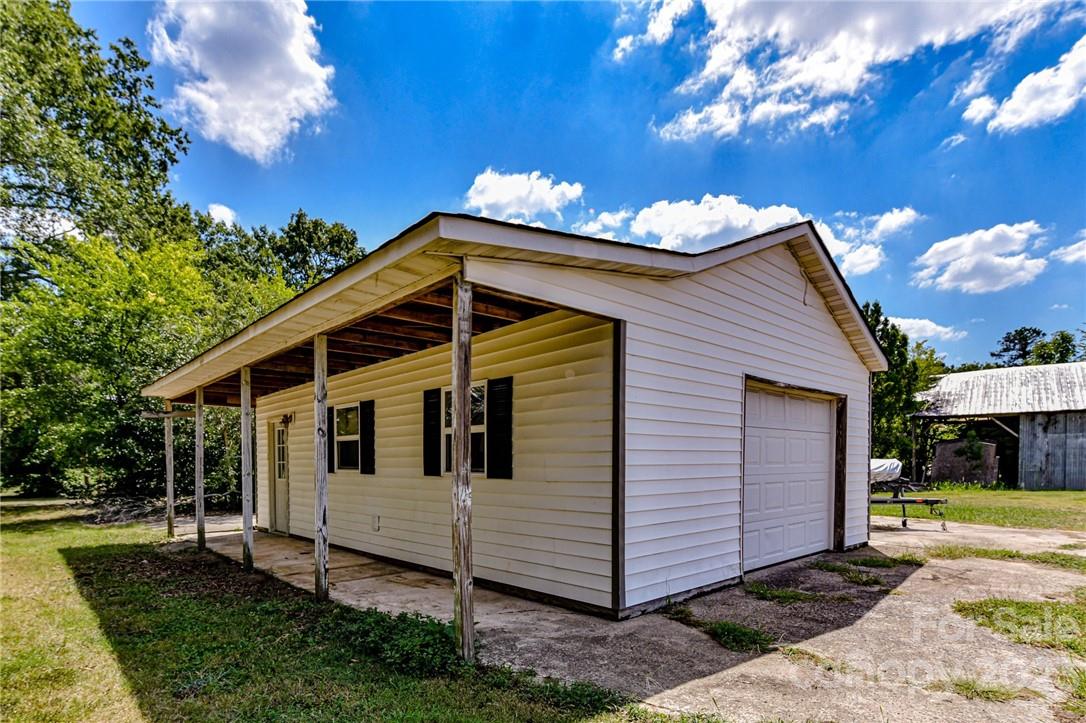 6308 Indian Trail Fairview Road Hemby Bridge, NC 28079 - Photo 5 of 36 a view of a house with a yard