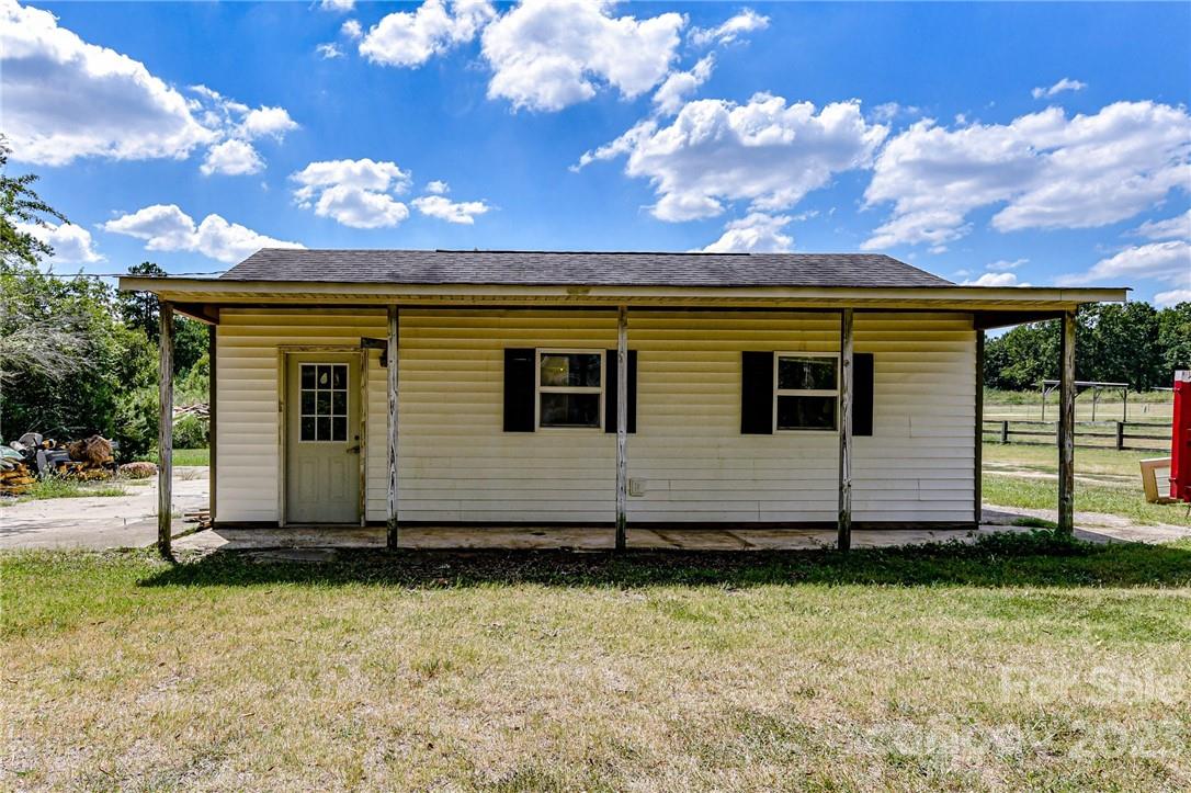 6308 Indian Trail Fairview Road Hemby Bridge, NC 28079 - Photo 6 of 36 a view of a house with a yard