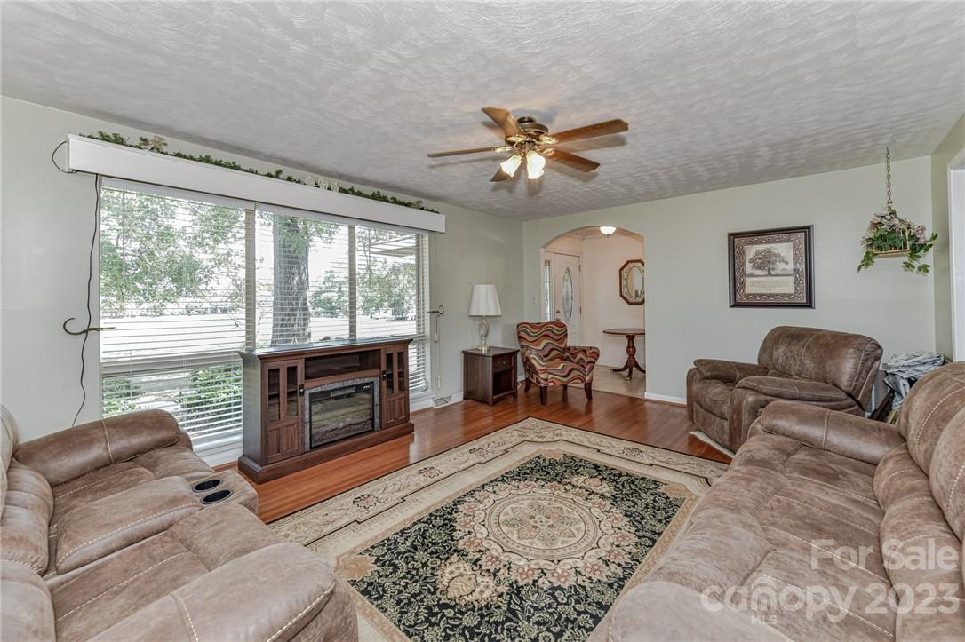 6308 Indian Trail Fairview Road Hemby Bridge, NC 28079 - Photo 8 of 36 a living room with furniture and a fireplace