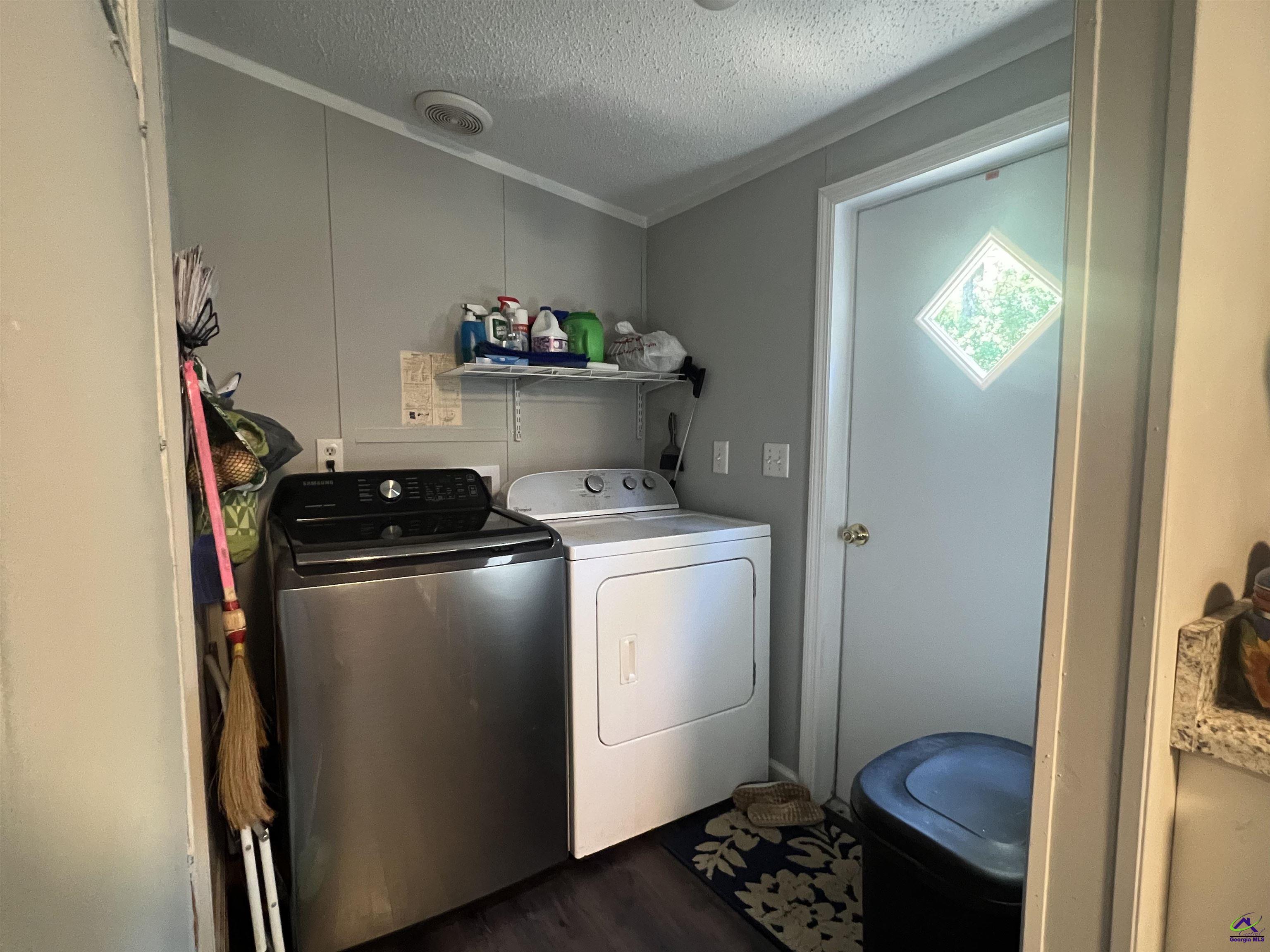 166 Pebble Hills Road Cochran, GA 31014 - Photo 12 of 27 a room with storage and utility