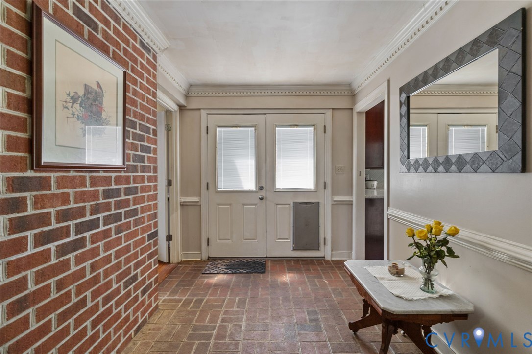 Stunning Brick floored front to back Foyer.