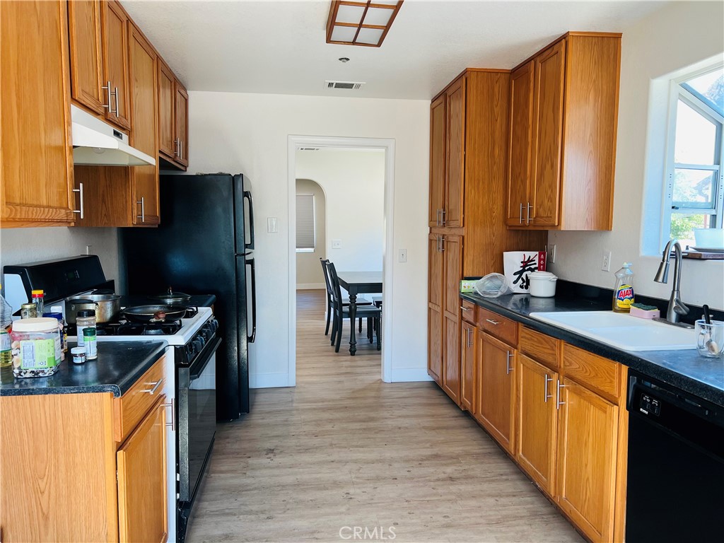 405 Fifth Avenue Arcadia, CA 91006 - Photo 11 of 18 a kitchen with stainless steel appliances granite countertop a stove a sink dishwasher and a refrigerator