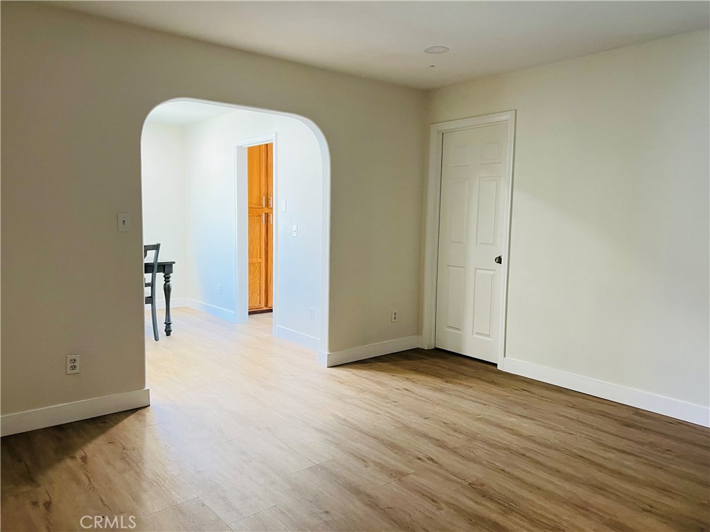 405 Fifth Avenue Arcadia, CA 91006 - Photo 12 of 18 a view of an empty room with wooden floor and a window