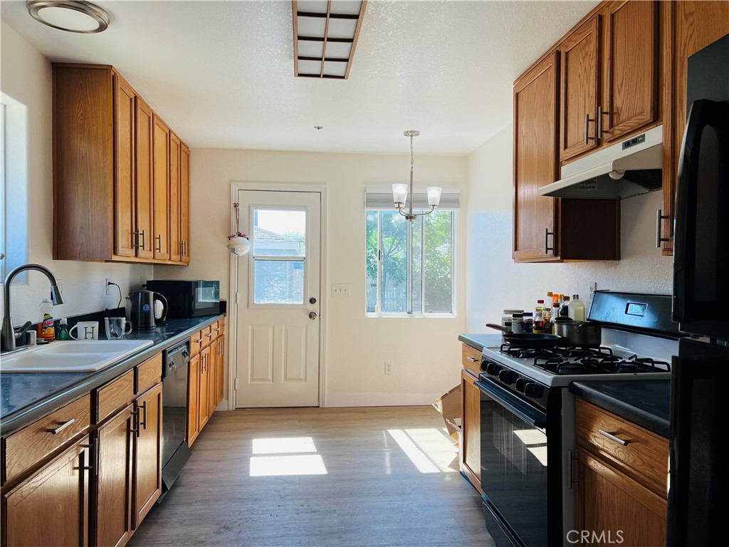 405 Fifth Avenue Arcadia, CA 91006 - Photo 13 of 18 a kitchen with stainless steel appliances a sink stove and cabinets