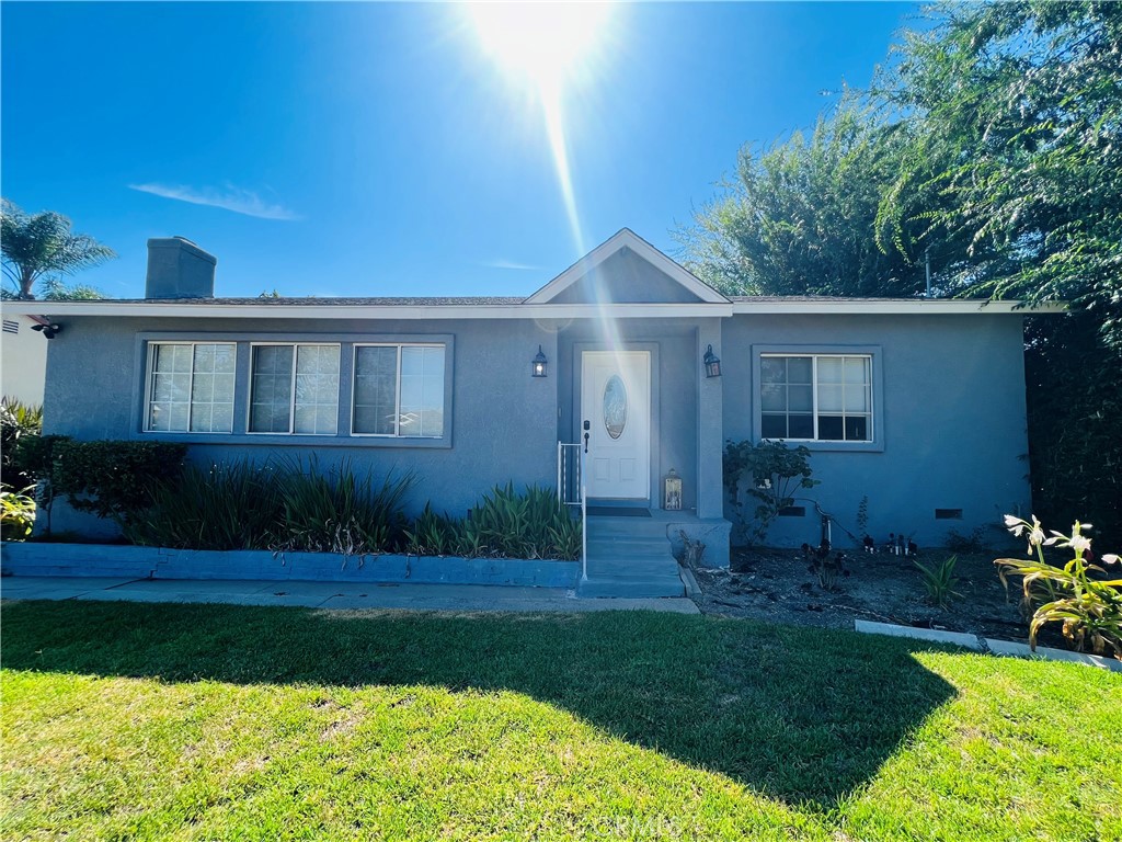 405 Fifth Avenue Arcadia, CA 91006 - Photo 17 of 18 a front view of a house with a garden