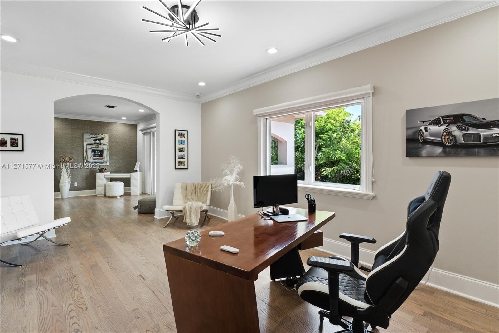 7740 Southwest 128th Street Pinecrest, FL 33156 - Photo 11 of 56 a view of a workspace with furniture and a window