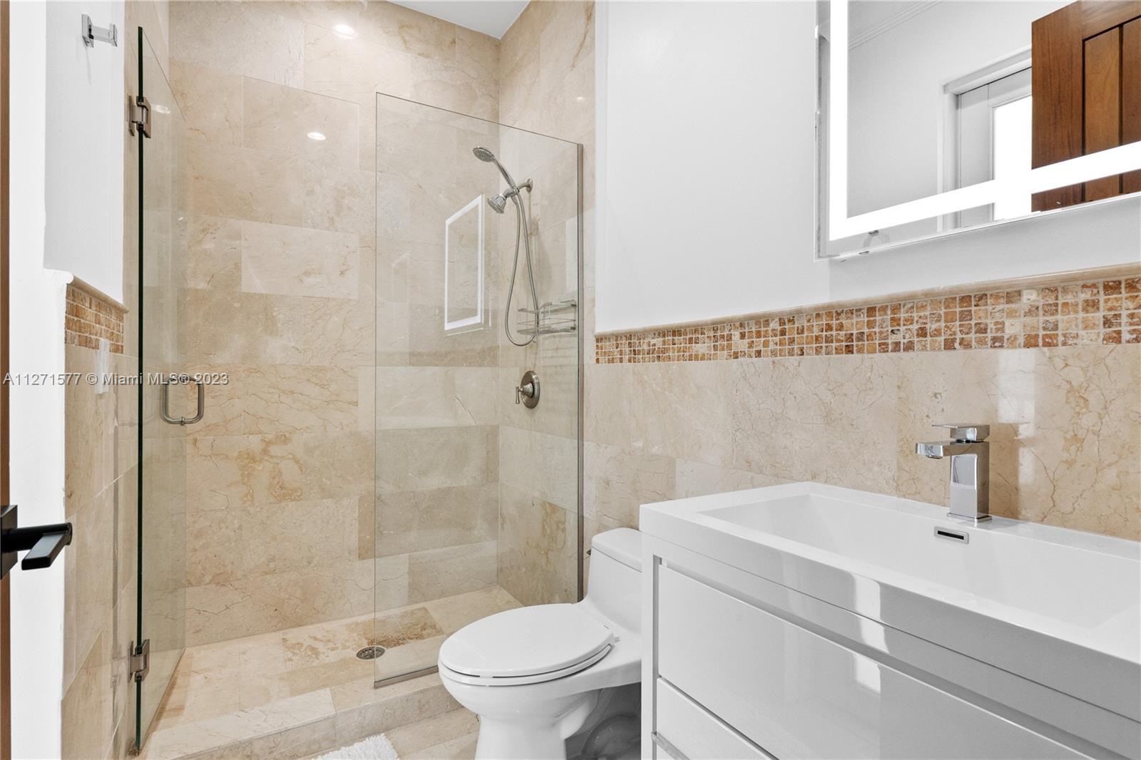 7740 Southwest 128th Street Pinecrest, FL 33156 - Photo 26 of 56 a bathroom with a sink toilet and shower