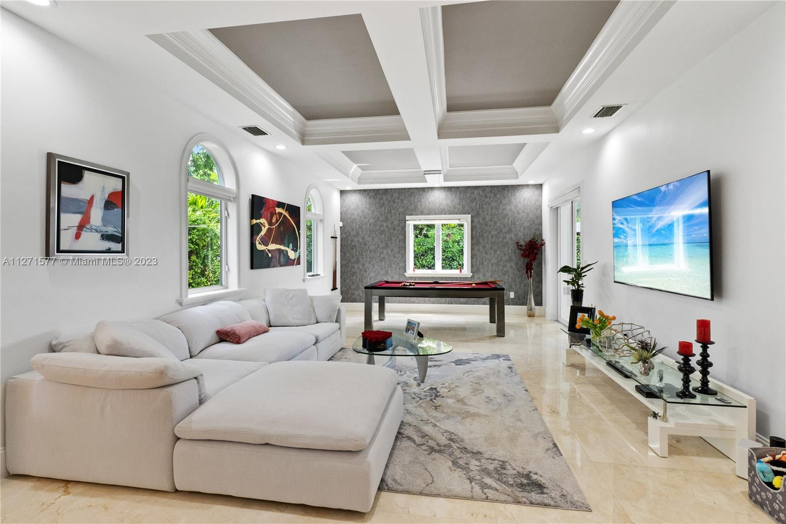 7740 Southwest 128th Street Pinecrest, FL 33156 - Photo 29 of 56 a living room with furniture and a flat screen tv