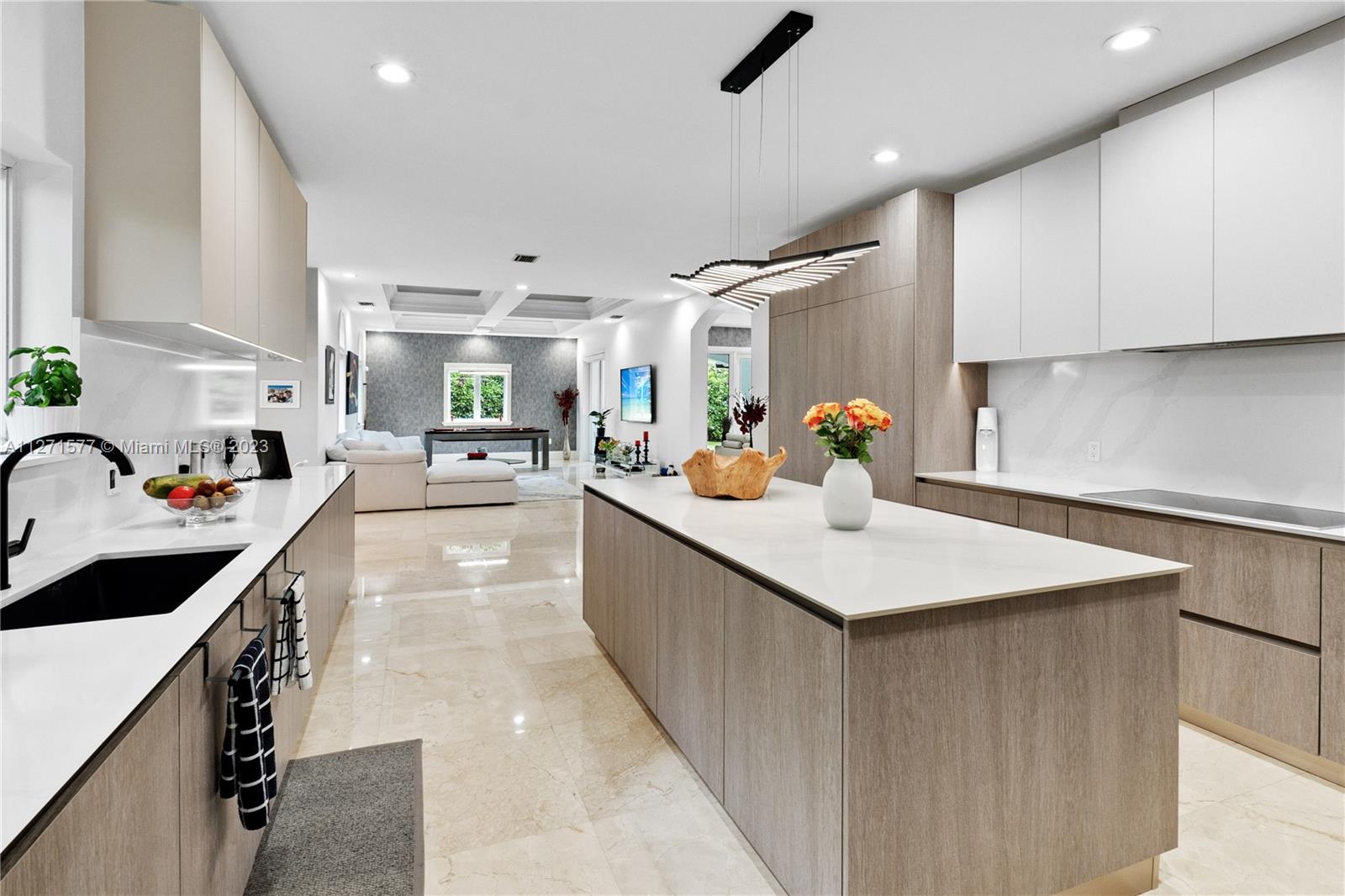 7740 Southwest 128th Street Pinecrest, FL 33156 - Photo 30 of 56 a kitchen with a sink appliances and cabinets