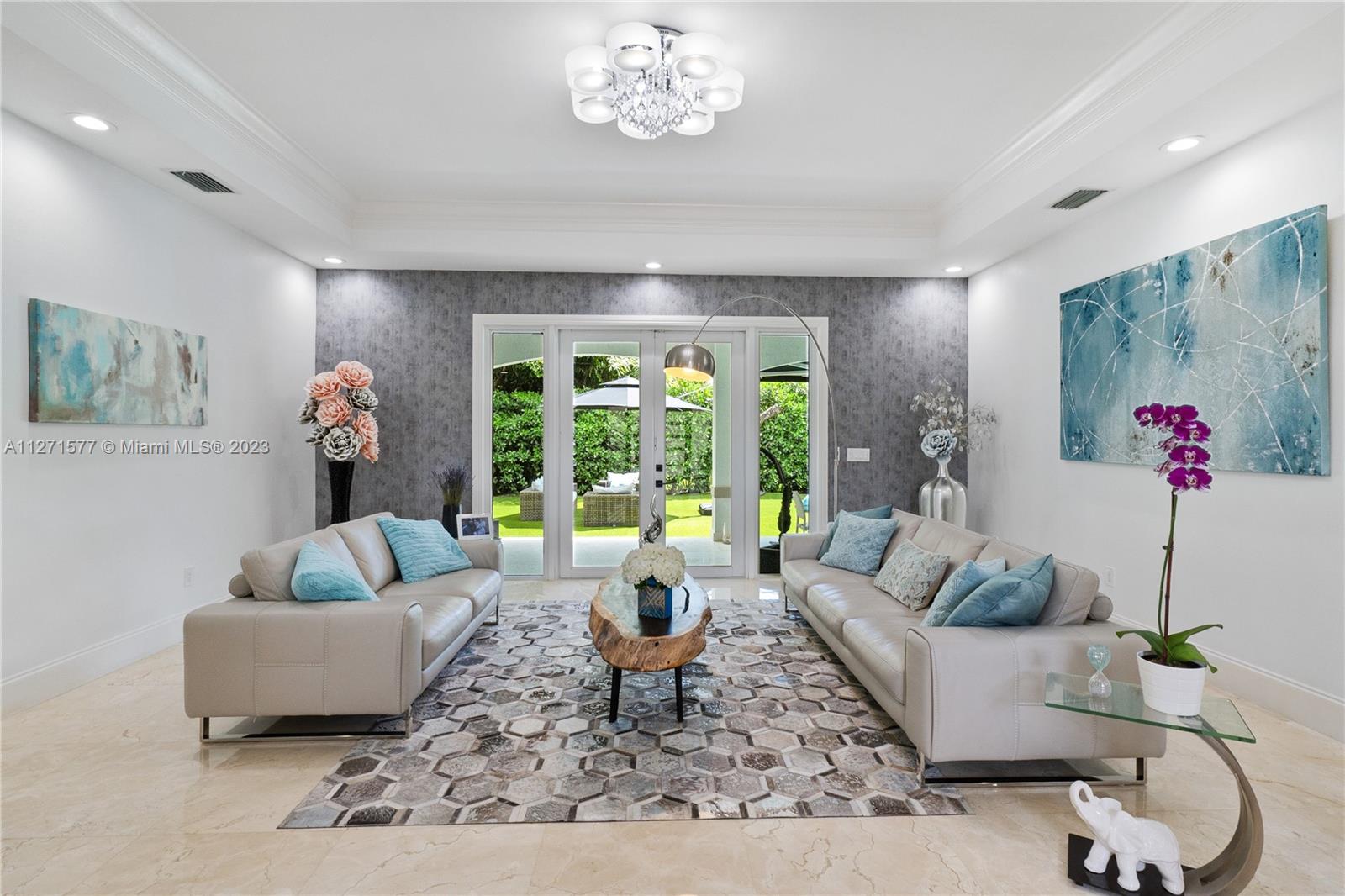 7740 Southwest 128th Street Pinecrest, FL 33156 - Photo 31 of 56 a living room with furniture and a large window