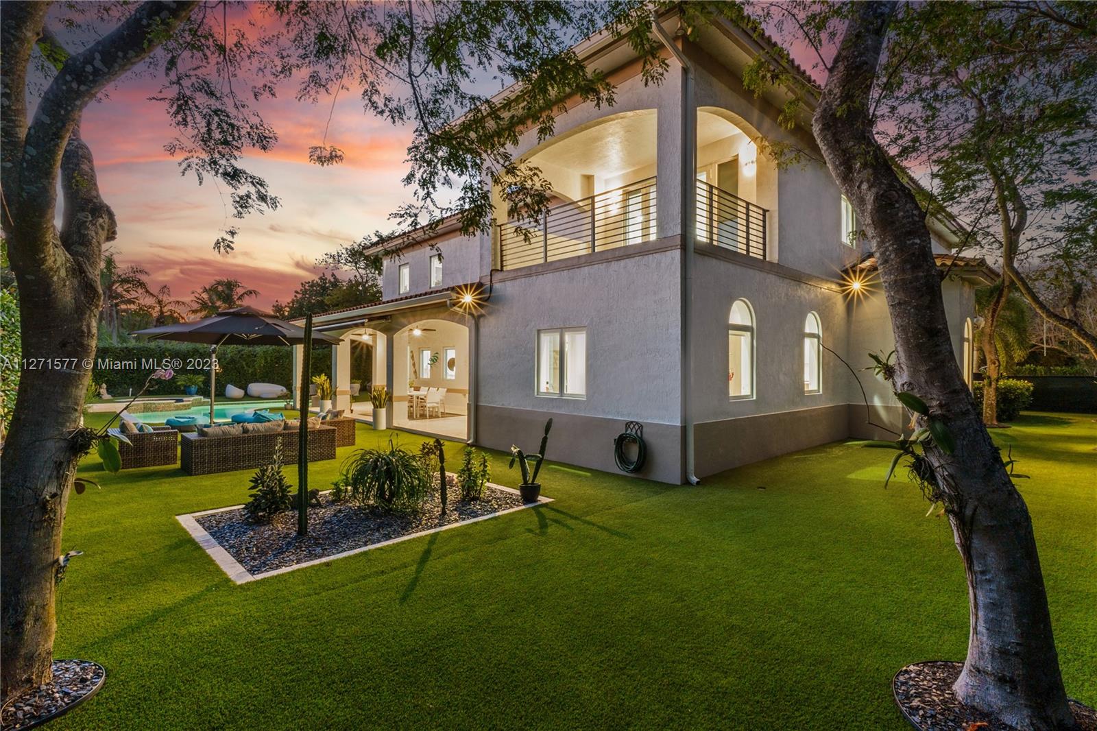 7740 Southwest 128th Street Pinecrest, FL 33156 - Photo 46 of 56 a view of a house with backyard porch and sitting area