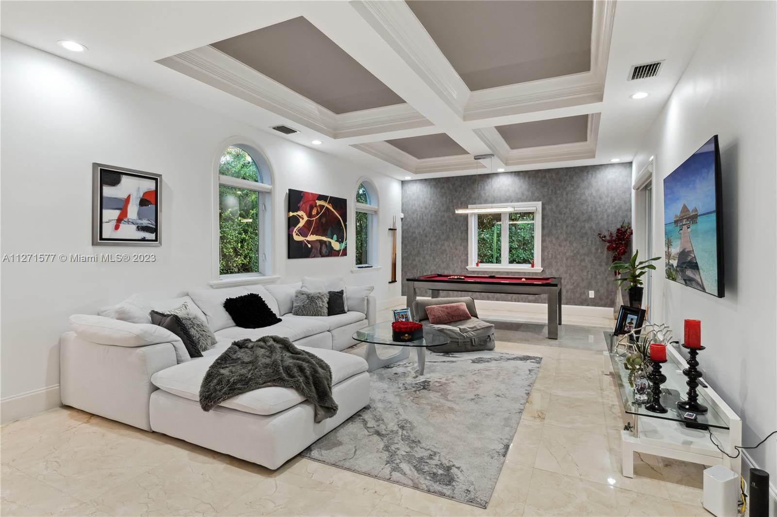 7740 Southwest 128th Street Pinecrest, FL 33156 - Photo 52 of 56 a living room with furniture and a flat screen tv