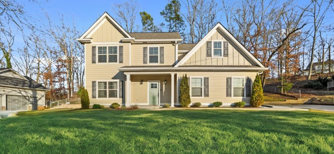 1048 Hurricane Creek Road Chattanooga, TN 37421 - Photo 1 of 31 a view of a white house with a yard and plants