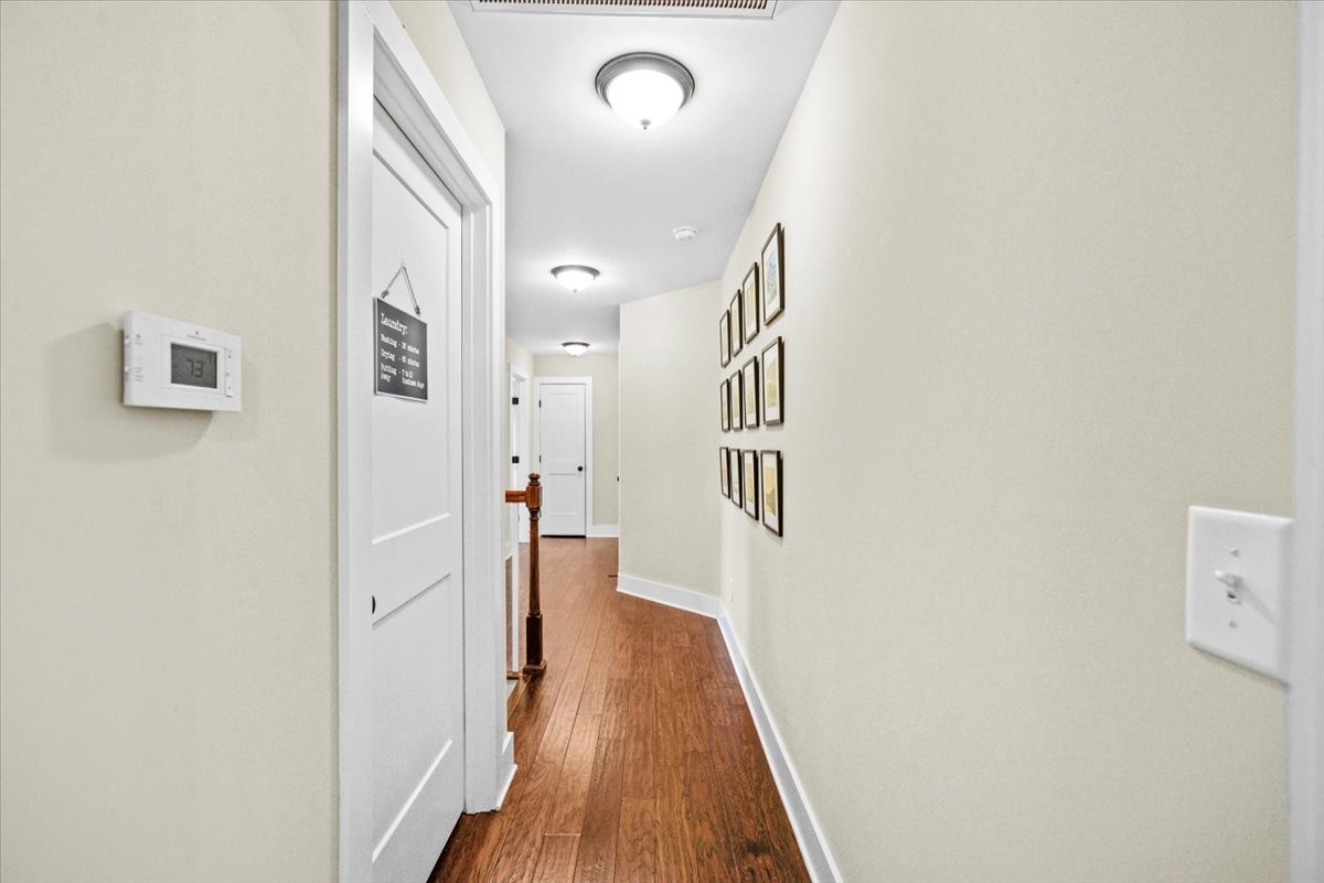 1048 Hurricane Creek Road Chattanooga, TN 37421 - Photo 19 of 31 a view of a hallway with wooden floor
