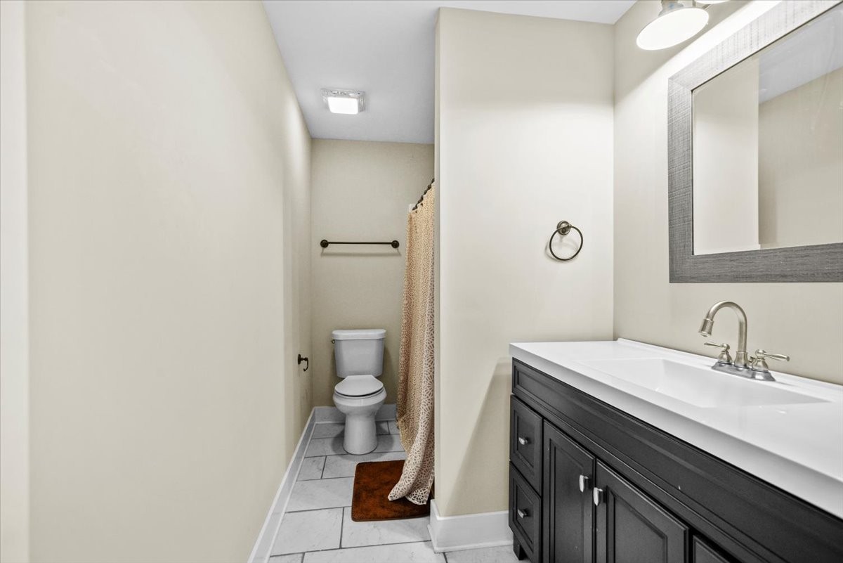 1048 Hurricane Creek Road Chattanooga, TN 37421 - Photo 21 of 31 a bathroom with a sink a toilet and shower
