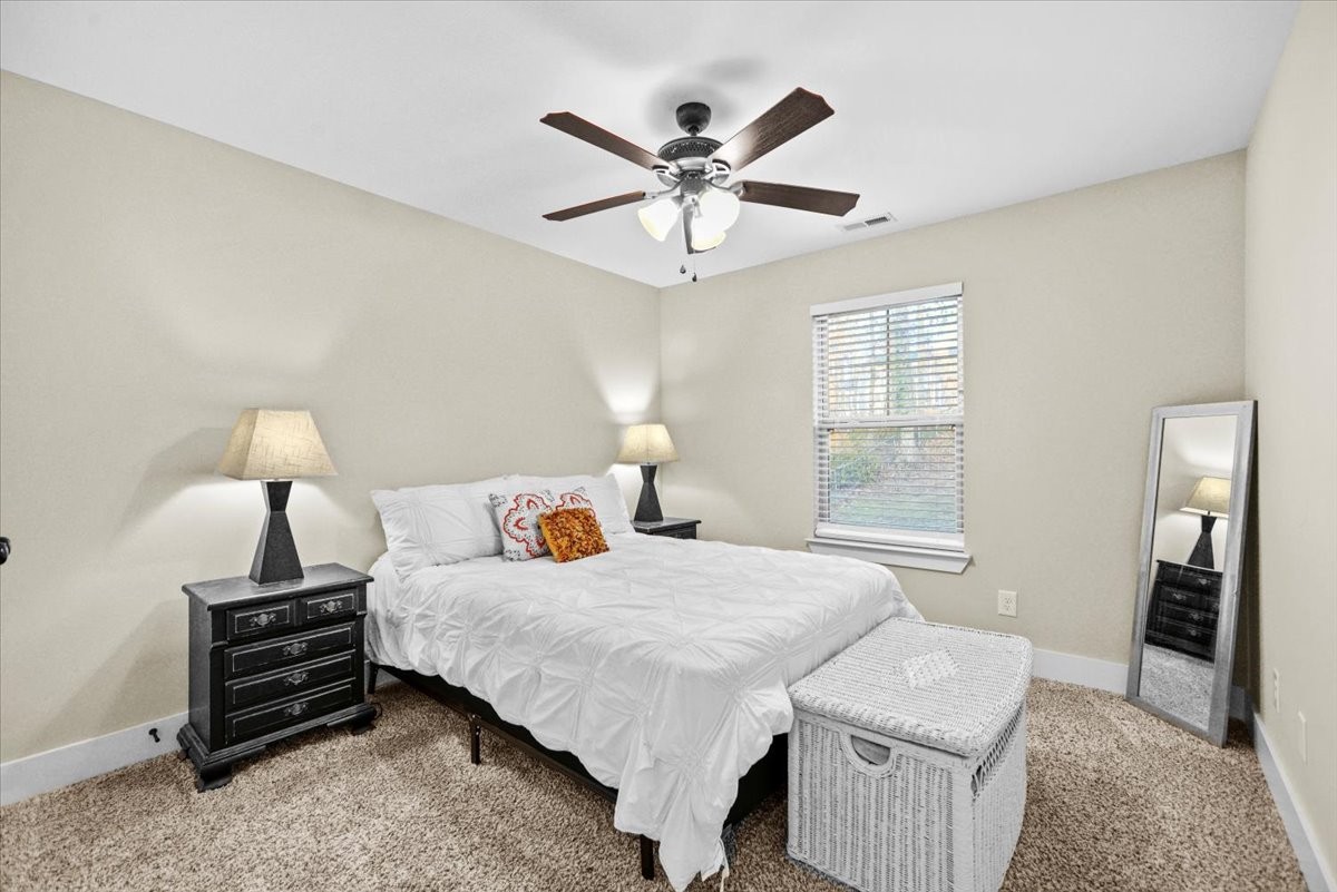 1048 Hurricane Creek Road Chattanooga, TN 37421 - Photo 22 of 31 a bedroom with a bed and a chandelier