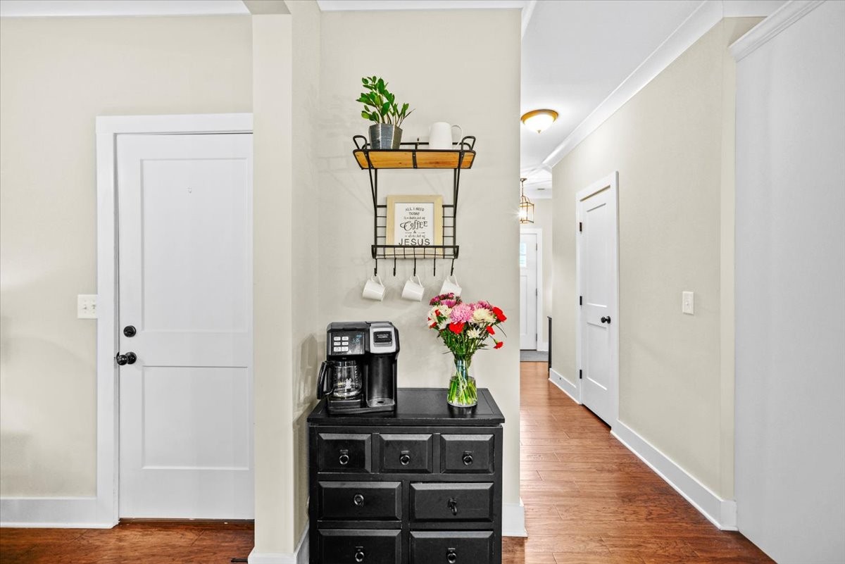 1048 Hurricane Creek Road Chattanooga, TN 37421 - Photo 9 of 31 a hallway with wooden floor and a potted plant