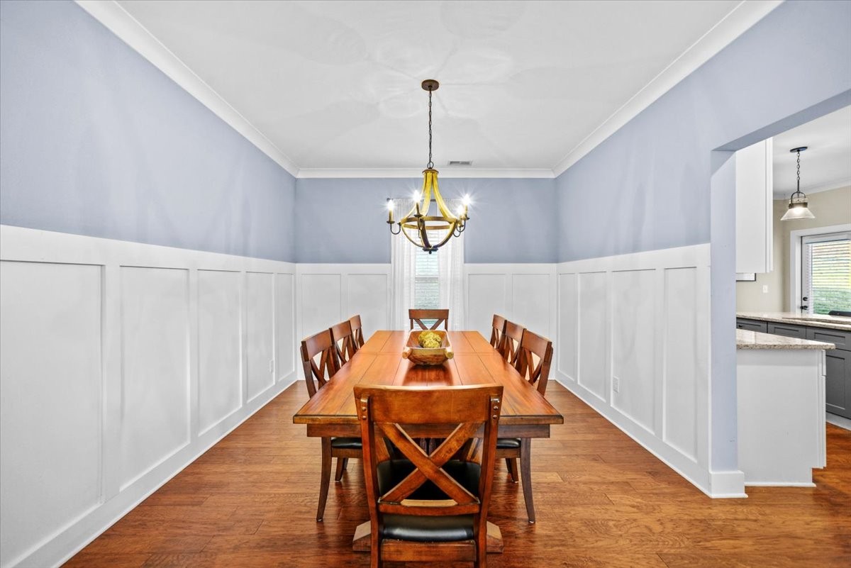 1048 Hurricane Creek Road Chattanooga, TN 37421 - Photo 10 of 31 a view of a dining room with furniture and wooden floor