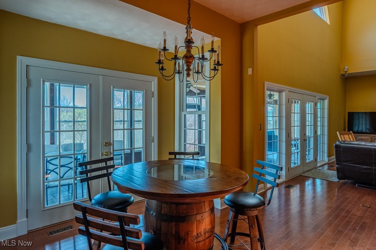 434 Rector Road Parkersburg, WV 26104 - Photo 38 of 50 Dining room with wood finished floors, a notable chandelier, french doors, and visible vents