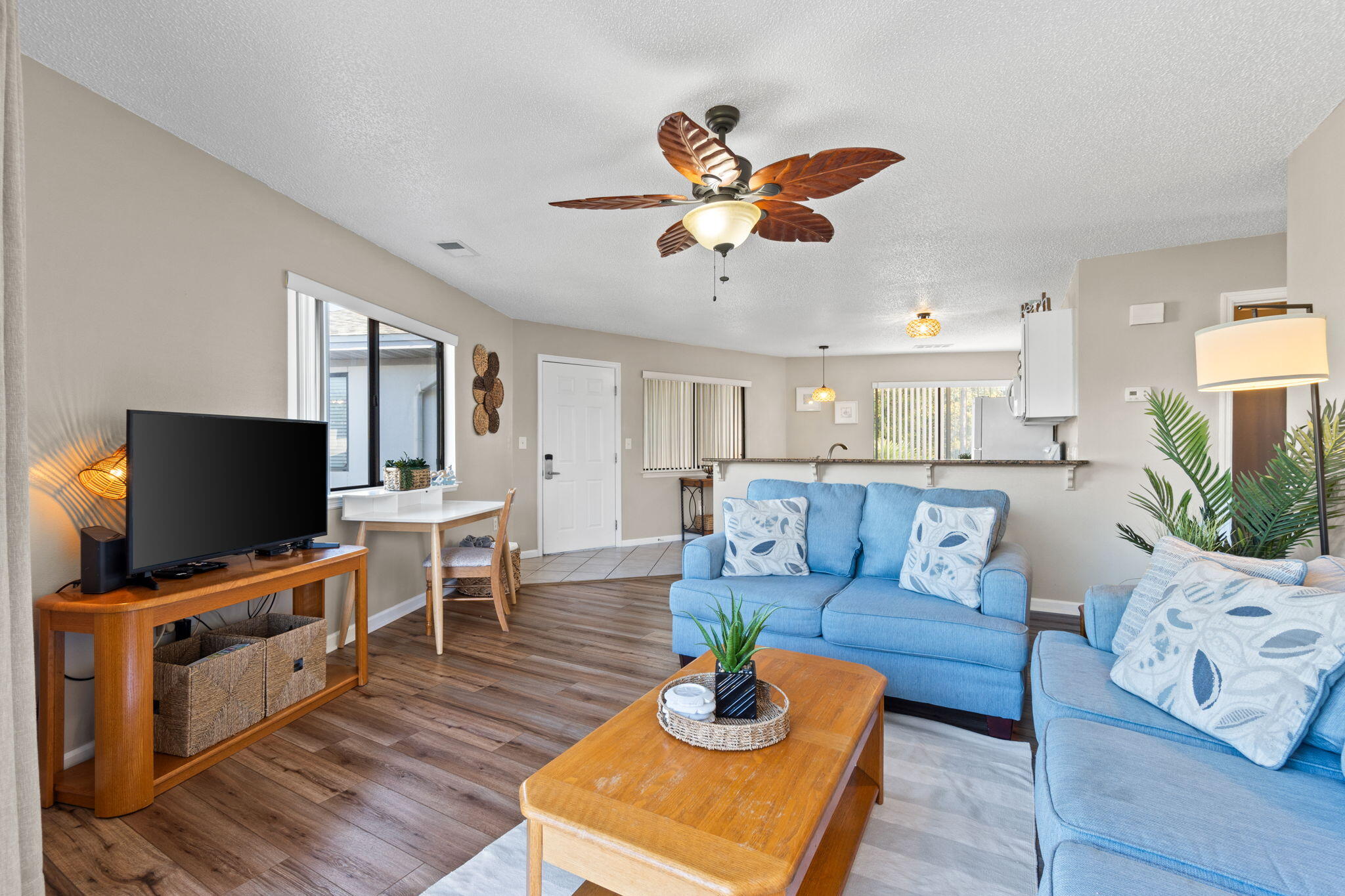 285 Payne Street, Unit 23B Miramar Beach, FL 32550 - Photo 1 of 41 a living room with furniture and a flat screen tv