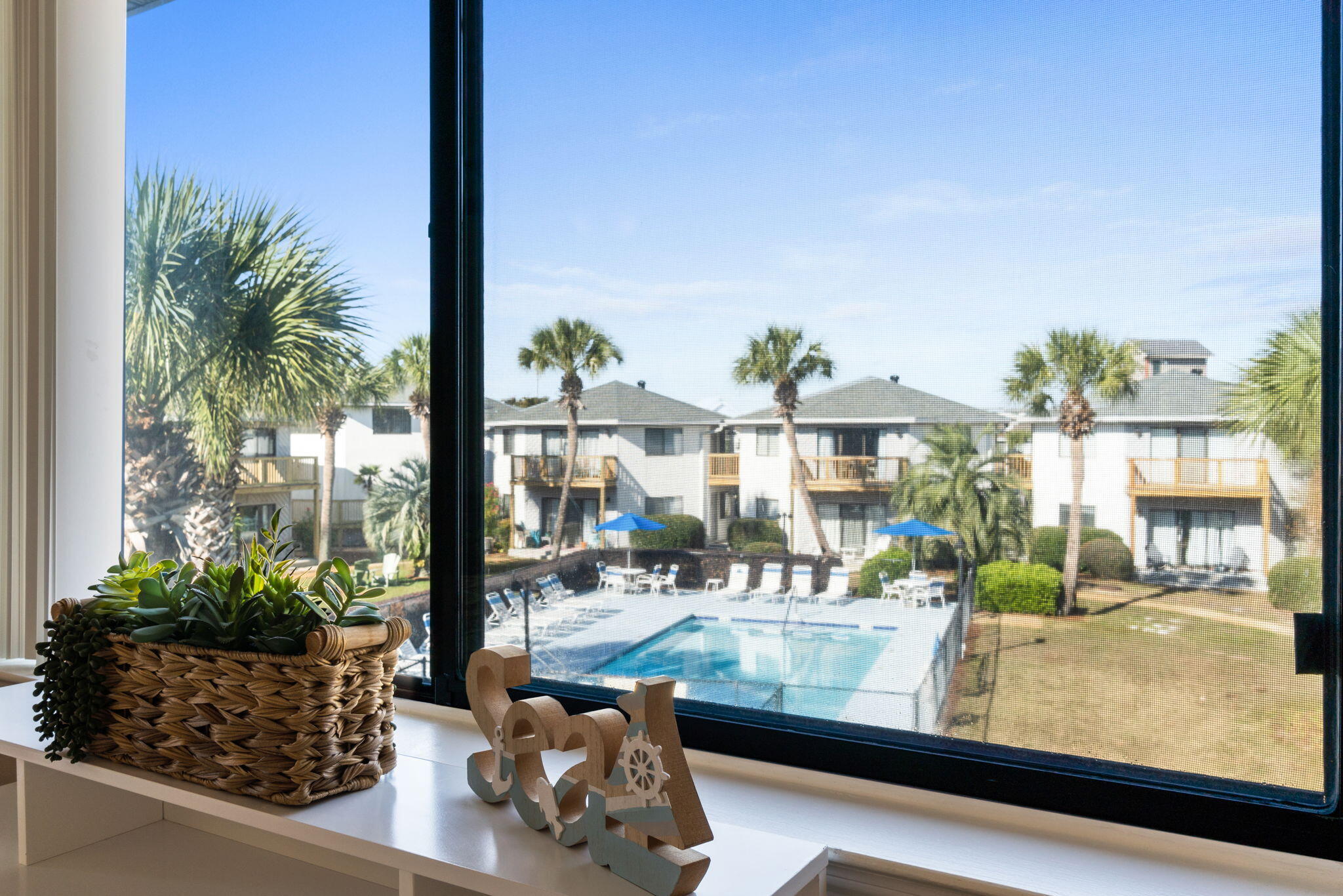 285 Payne Street, Unit 23B Miramar Beach, FL 32550 - Photo 11 of 41 a view of living room and patio