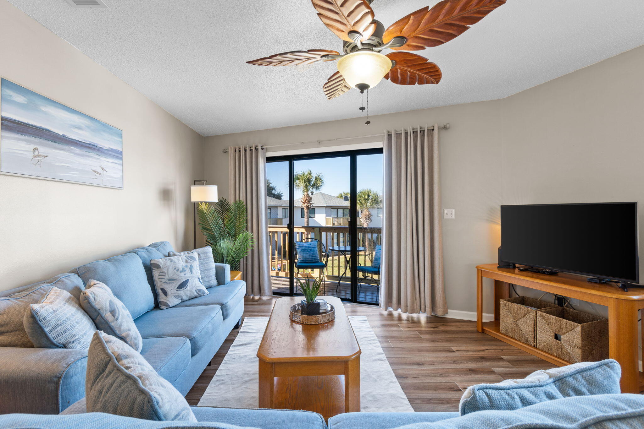 285 Payne Street, Unit 23B Miramar Beach, FL 32550 - Photo 13 of 41 a living room with furniture and a flat screen tv