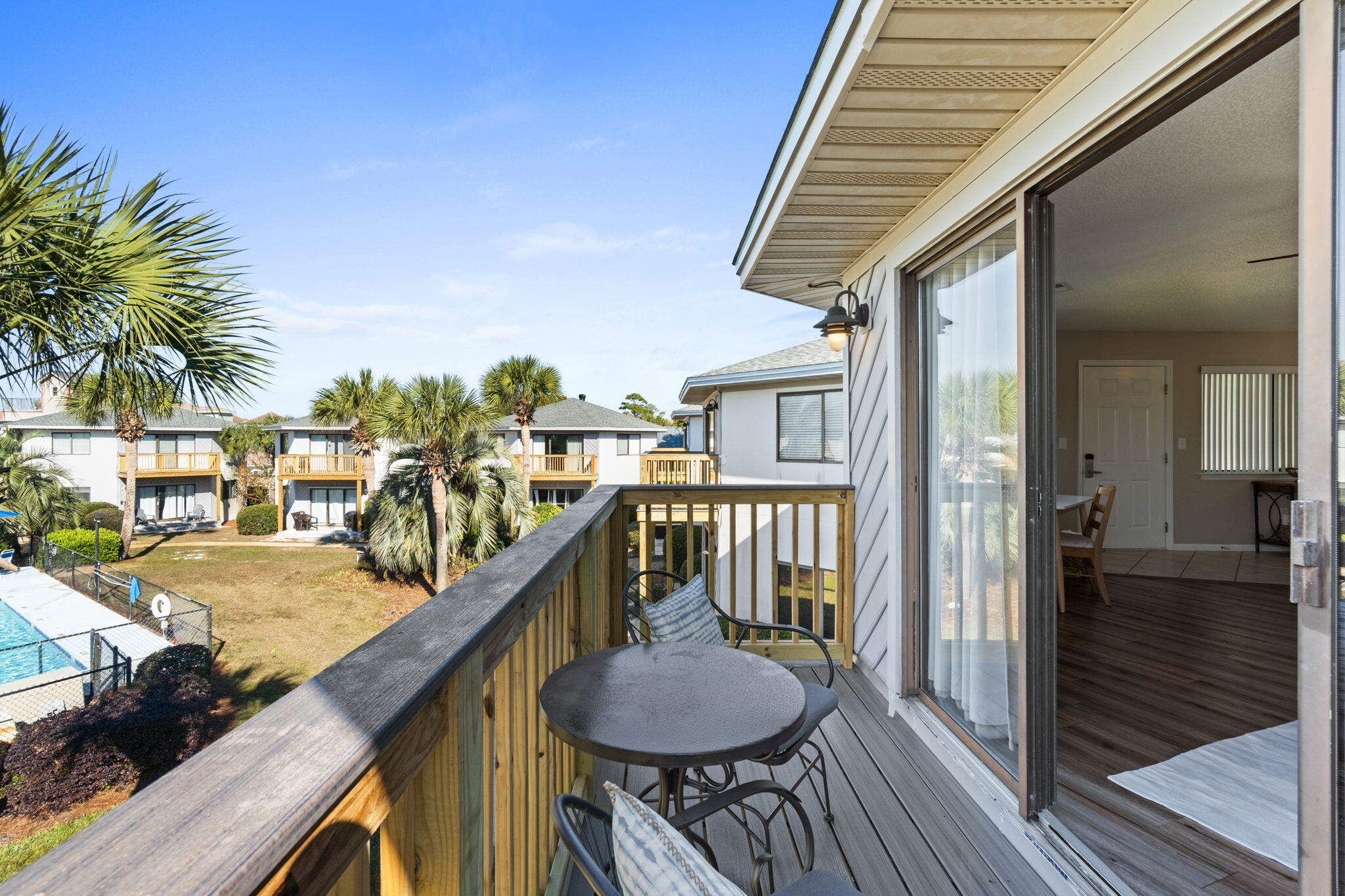 285 Payne Street, Unit 23B Miramar Beach, FL 32550 - Photo 16 of 41 a balcony view with a sink and wooden floor
