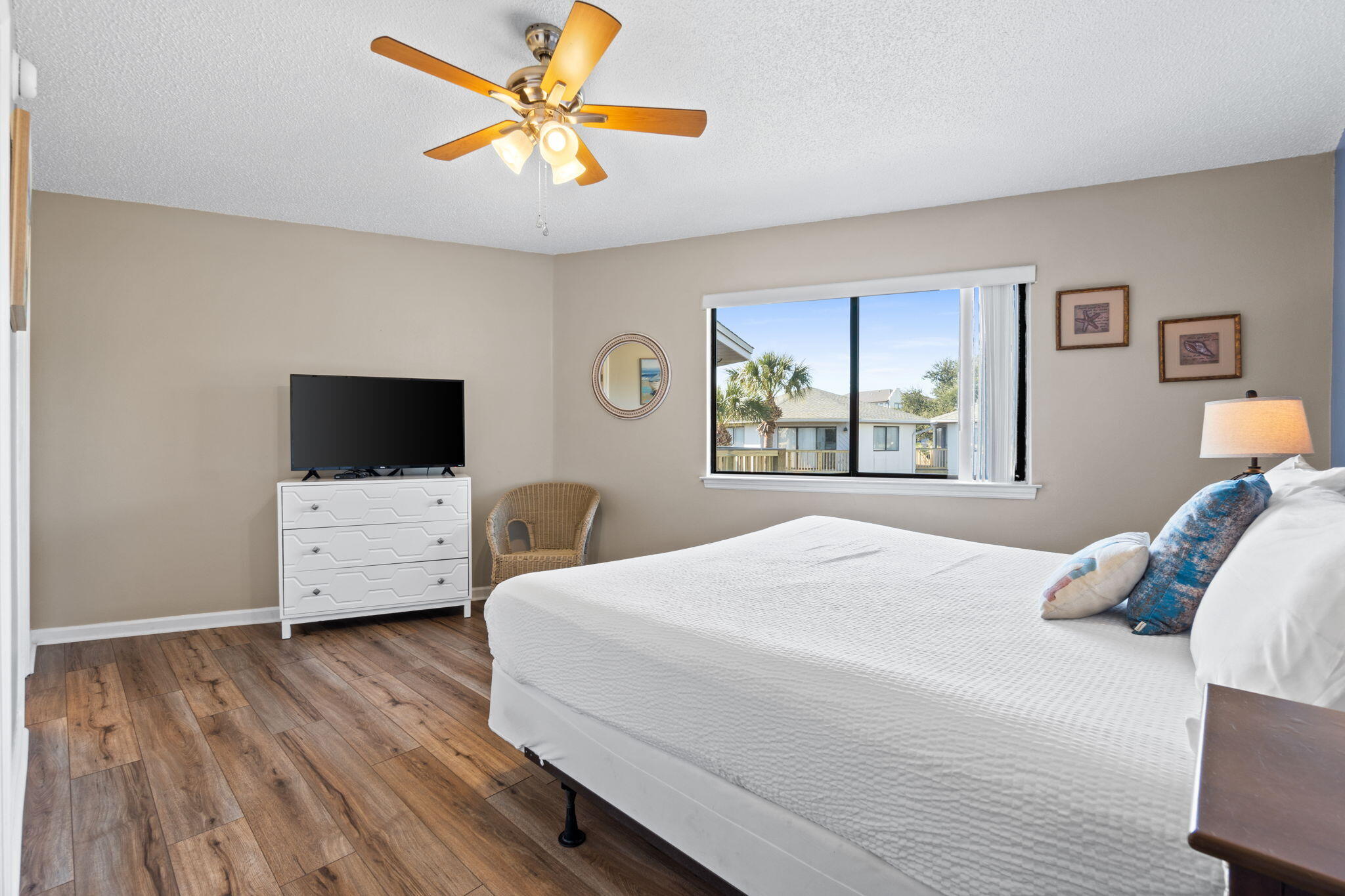 285 Payne Street, Unit 23B Miramar Beach, FL 32550 - Photo 18 of 41 a bedroom with a bed and a flat screen tv