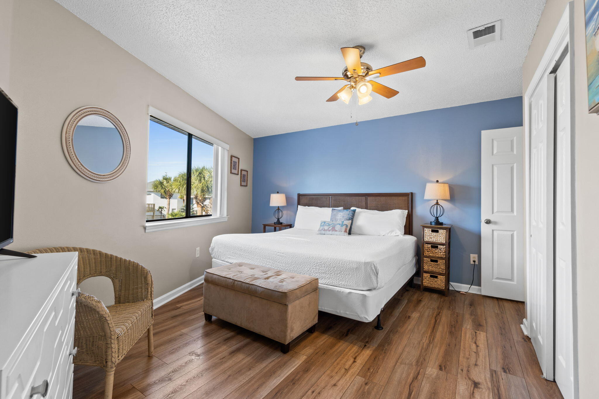 285 Payne Street, Unit 23B Miramar Beach, FL 32550 - Photo 19 of 41 a bedroom with a bed and a chandelier