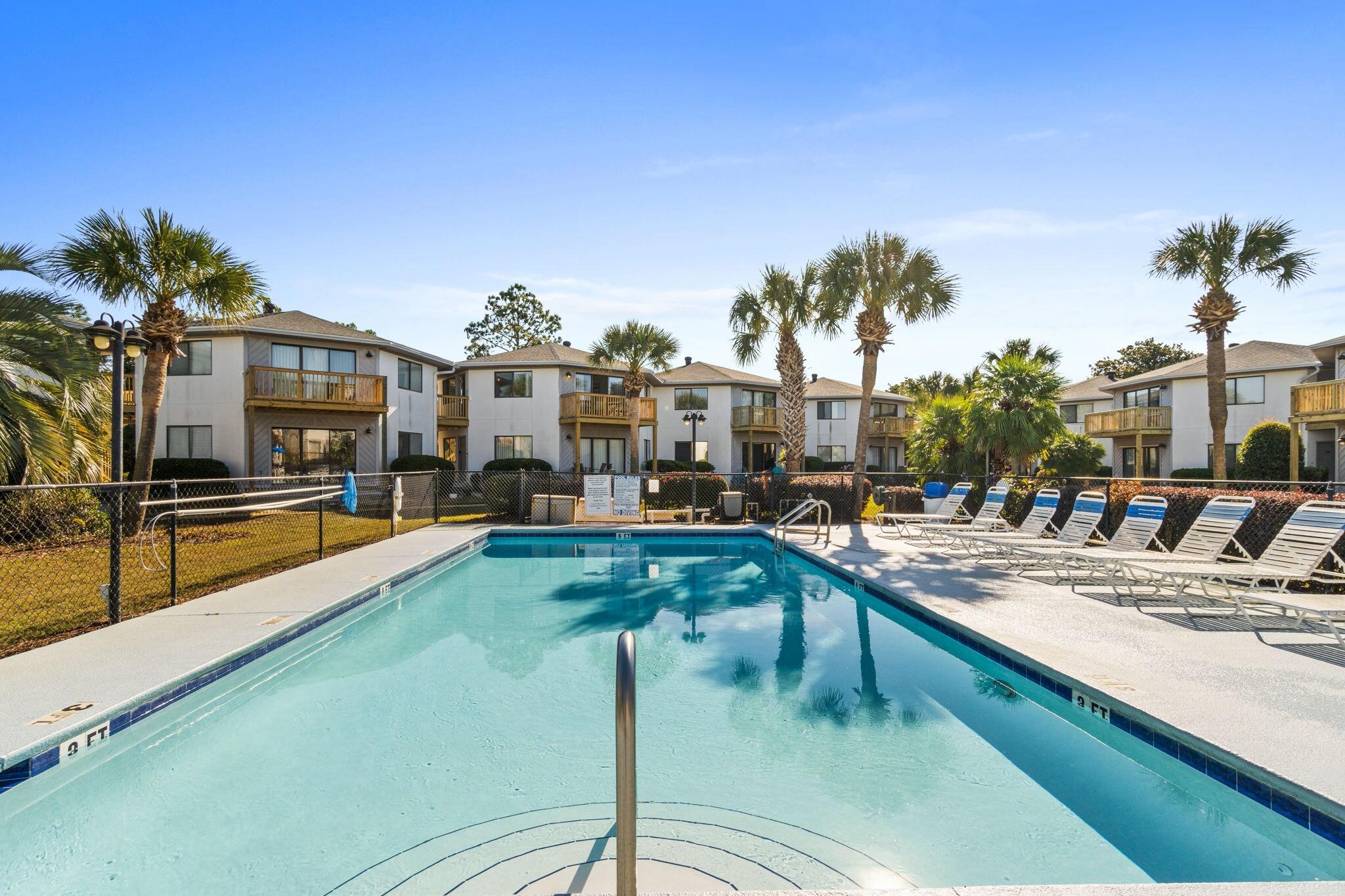 285 Payne Street, Unit 23B Miramar Beach, FL 32550 - Photo 2 of 41 a view of a swimming pool with an outdoor seating