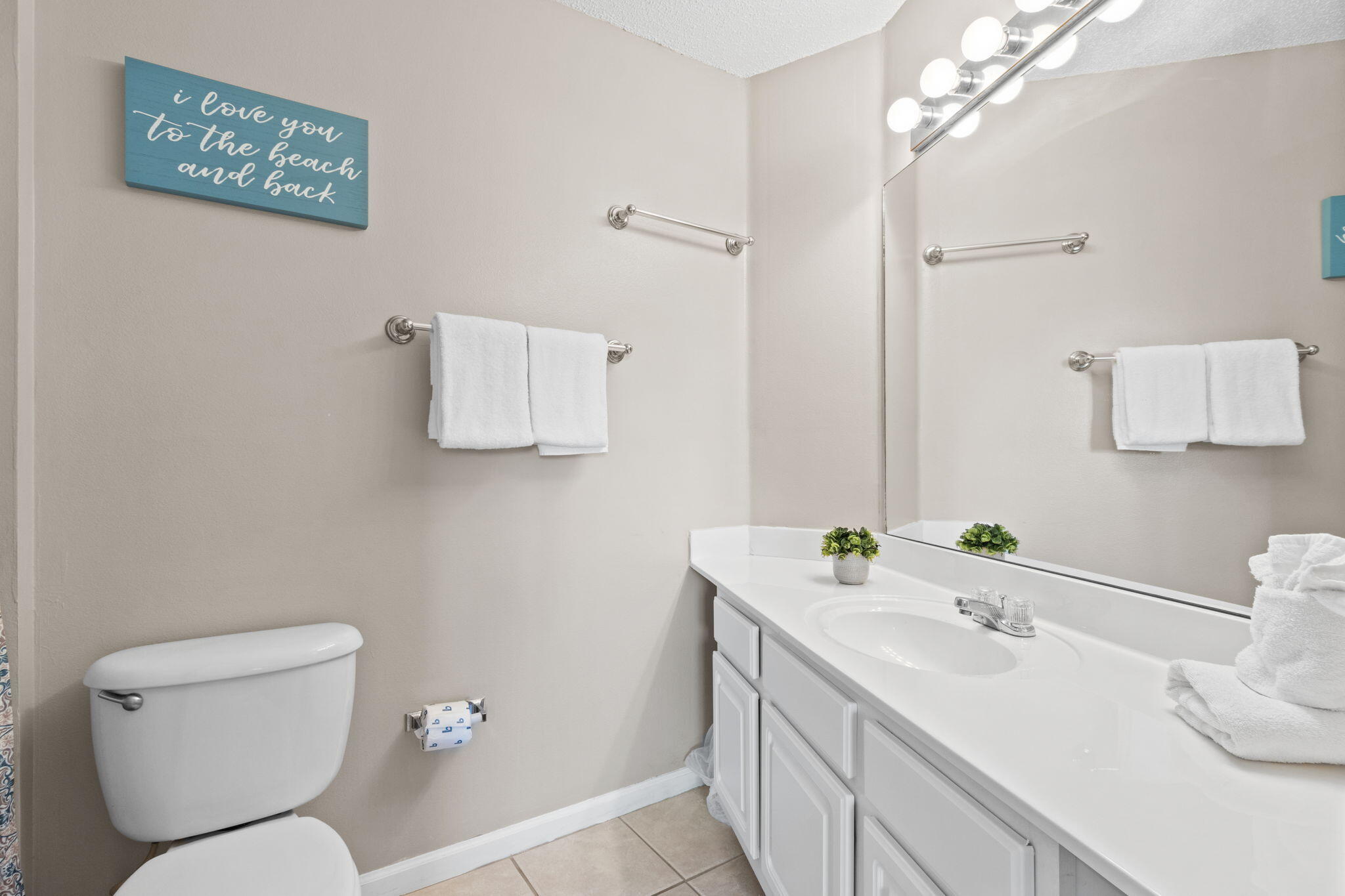 285 Payne Street, Unit 23B Miramar Beach, FL 32550 - Photo 21 of 41 a bathroom with a sink toilet and mirror