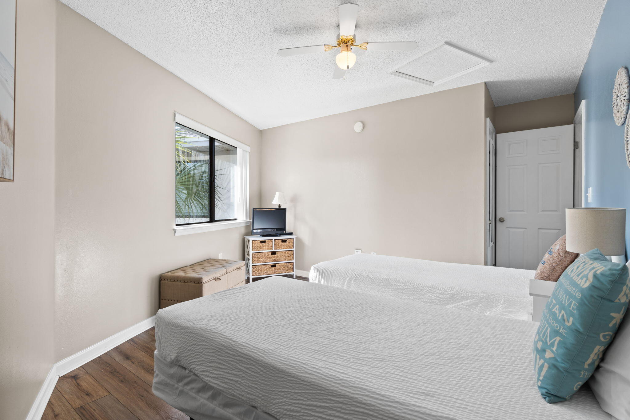 285 Payne Street, Unit 23B Miramar Beach, FL 32550 - Photo 24 of 41 a bedroom with a bed a chandelier and window