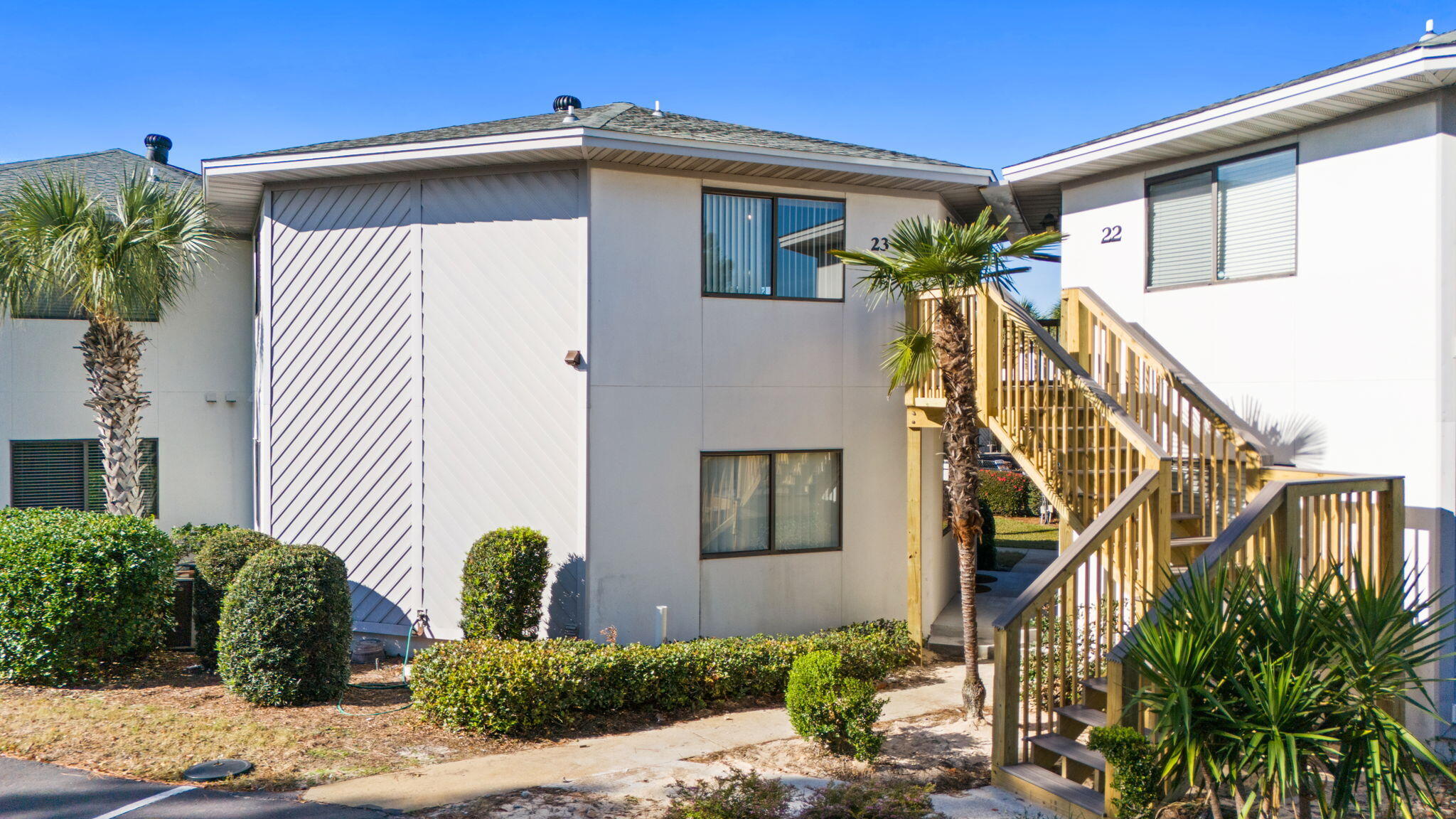 285 Payne Street, Unit 23B Miramar Beach, FL 32550 - Photo 27 of 41 a front view of a house with a yard