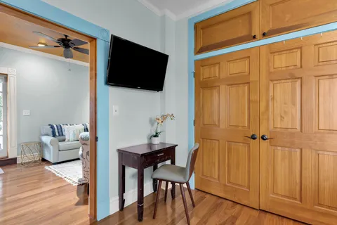 a view of a livingroom with furniture and wooden floor