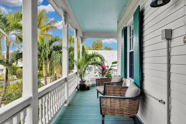 a view of two chairs in balcony