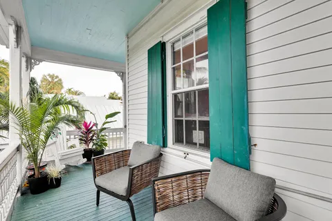 a outdoor living space with furniture and a potted plant