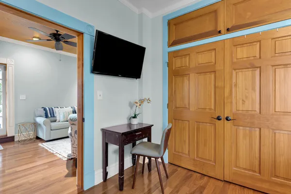 a view of a livingroom with furniture and wooden floor