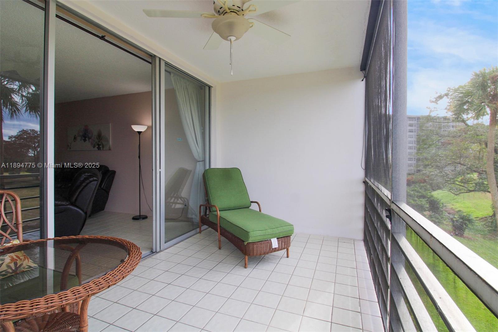 605 Oaks Drive, Unit 305 Pompano Beach, FL 33069 - Photo 11 of 31 a room with washing machine and mirror