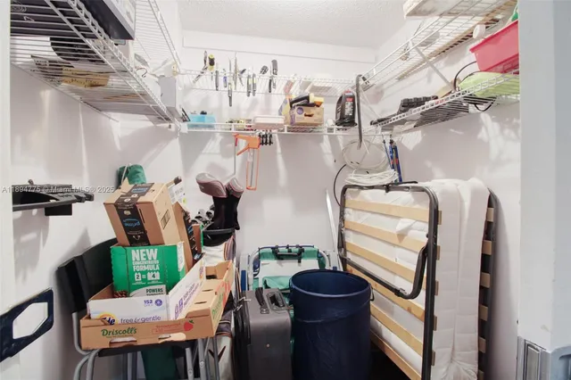 a view of hall way with furniture and rug