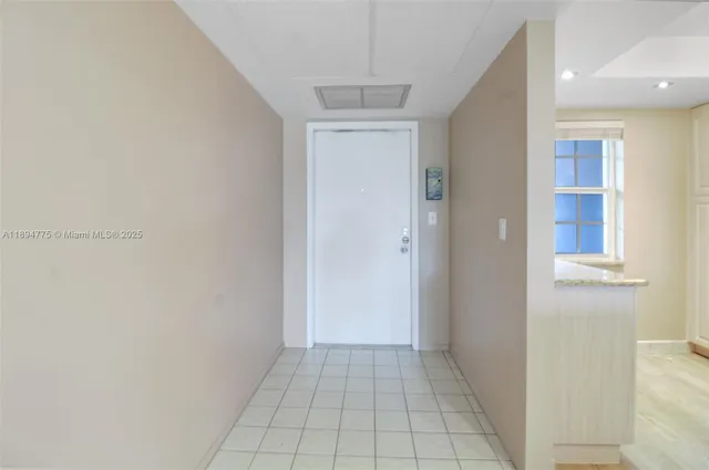 a view of an empty room and window