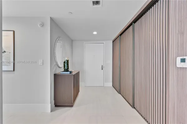 a hallway with a stove top oven