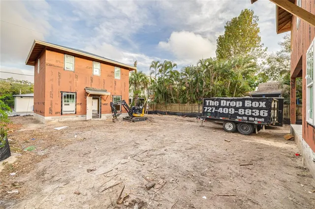a front view of a house with outdoor seating