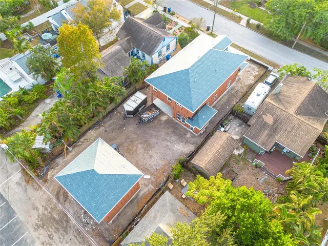 an aerial view of residential houses with outdoor space