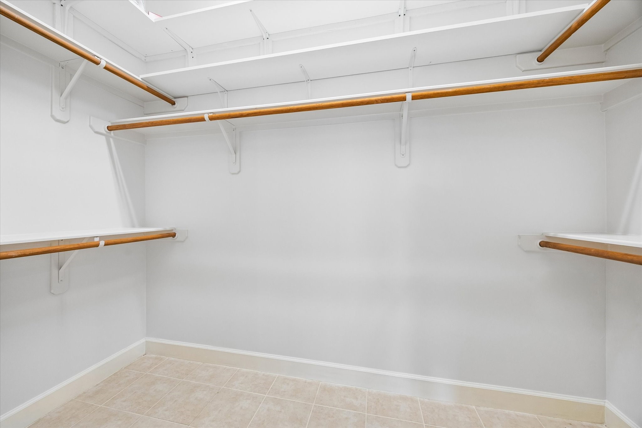 100 Willard Street, Unit 15 Houston, TX 77006 - Photo 17 of 25 The oversized primary walk-in closet offers exceptional storage space with built-in shelving and multiple hanging areas.
