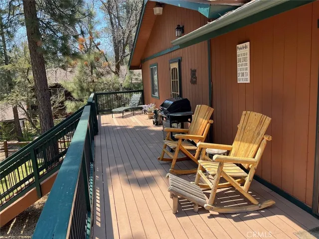 a view of two chairs in the balcony
